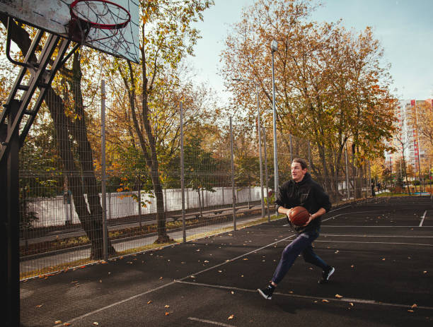 istock A basketball player runs to the ring outside in the fall 1820776895