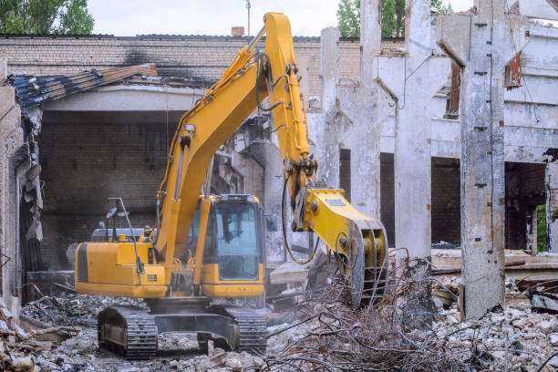 istock Hydraulic attachment pliers on excavator. Cleaning construction debris in collapsed industrial building. 1820781809