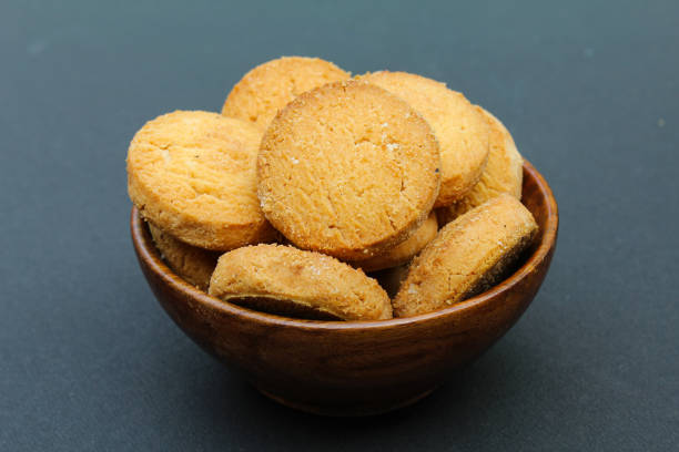 istock Osmania biscuits in a wooden bowl on black background 1820783939