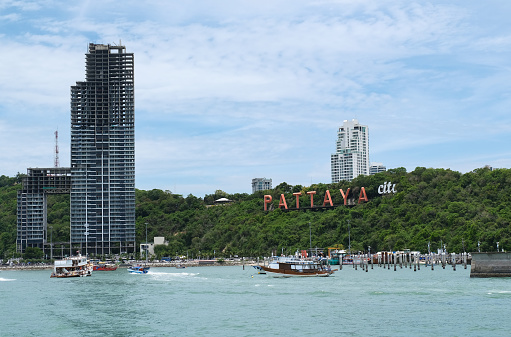 Thailand Pattaya city cityscape with letters  view from sea