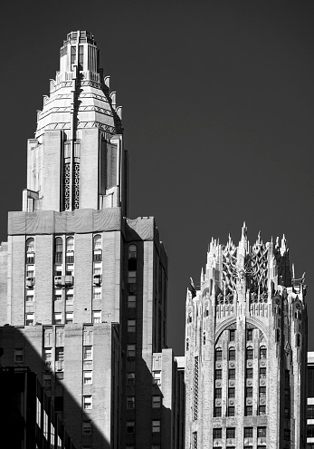 Shown here are one of the two towers of the Waldorf Astoria hotel in the foreground, and, a block north, the tower of 570 Lexington Avenue, formerly the General Electric Building. 

Both buildings are prime examples of Art Deco skyscrapers that were built in New York City in the late 1920's and early 1930's, and they were both completed in 1931.