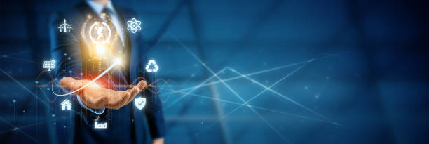 istock Hand holding a light bulb in front of a world map, representing global consumption with icons for renewable energy sources. 1820797780