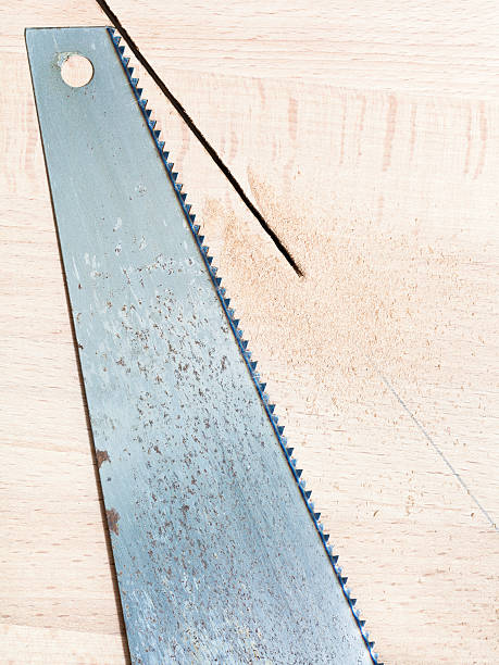 istock hacksaw at wooden board 182079933