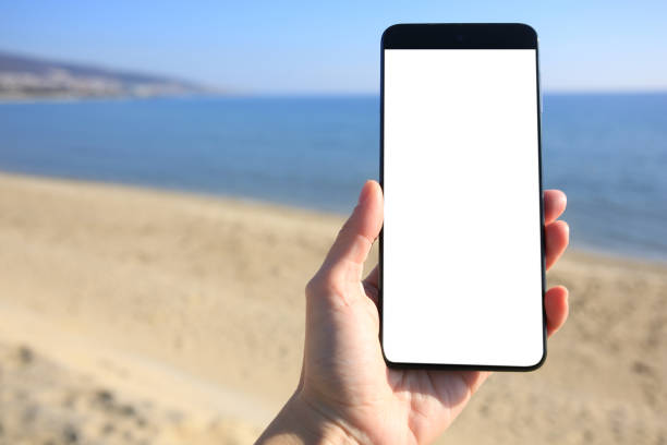 istock Man using weather forecast app on smartphone outdoors on sunny day, closeup. Space for text 1820813039