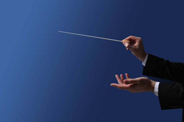 istock Professional conductor with baton on blue background, closeup 1820813177