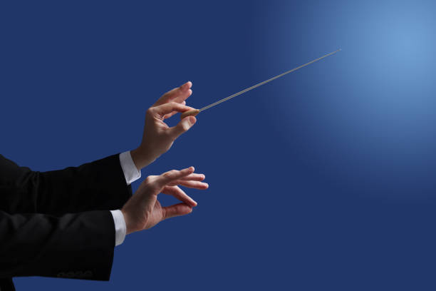 istock Professional conductor with baton on blue background, closeup 1820813233