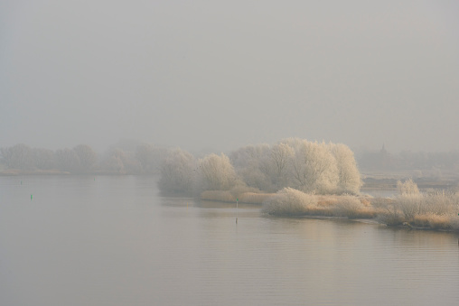 Winter landscape in the delta of the river IJssel near Kampen, The Netherlands. Kampen is an ancient Hanseatic League in Overijssel, The Netherlands.