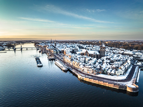 Kampen city view at the river IJssel during a cold winter sunrise