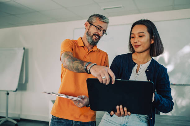 istock A multicultural businesspeople standing at office and discussing report 1820835305