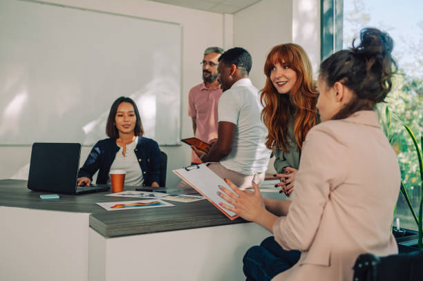 istock An executive with disability discussing on a meeting with team and boss. 1820835316