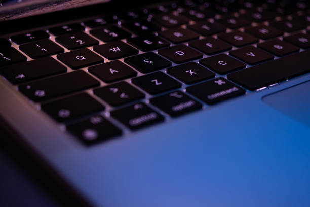 istock Laptop keyboard with backlight at the night office 1820842757