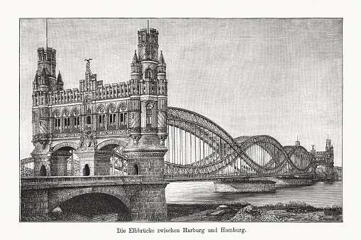 The Elbe river bridge (Neue Elbbrücke), between Harburg and Hamburg, Germany, built 1884 - 1887. The gothic revival arched elements were removed in 1959. Wood engraving, published in 1894.