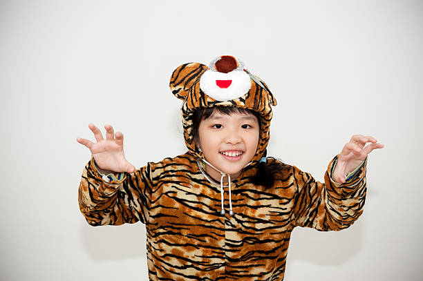 Asian little girl wearing a tiger costume
