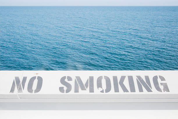 No smoking sign written on the Malibu Pier in Los Angeles. Words that seem to be perfect for a clean place as the open sea.
