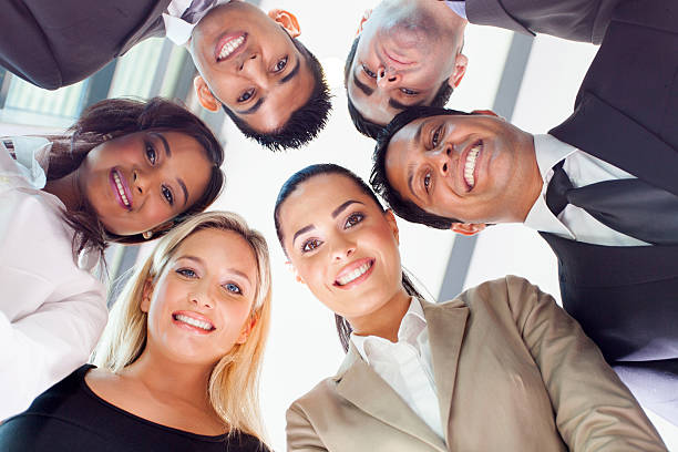 istock group of business people looking down 182086716