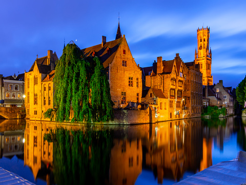 Brugge medieval architecture along Rozenhoedkaai canal at night, Bruges, Belgium