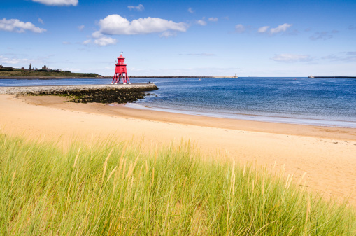 The Groyne Lighthouse at South Shields sits in the mouth of the River Tyne to protect the beach and help with navigation