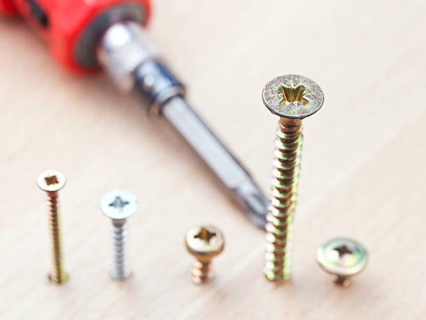 istock screws wrapped in wooden plank 182089032