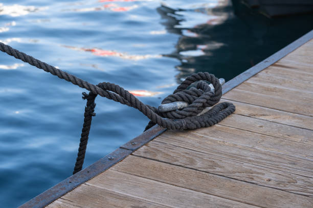 istock rope and cleat on wooden pier. 1820897523