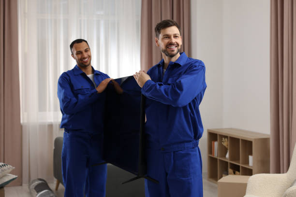 Male movers carrying plasma TV in new house Male movers carrying plasma TV in new house Hiring Professional TV Installers stock pictures, royalty-free photos & images
