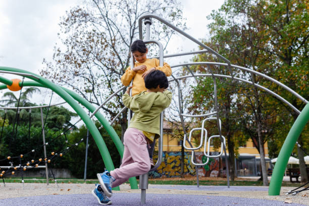 istock two girls swirling on playground 1820907703