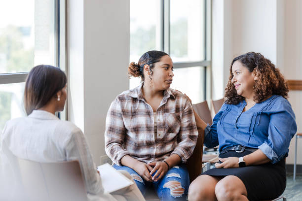 istock Adult daughter looks at her mom while she admits her struggles 1820929446