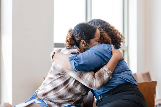 Mother and daughter hug each other during their counseling session