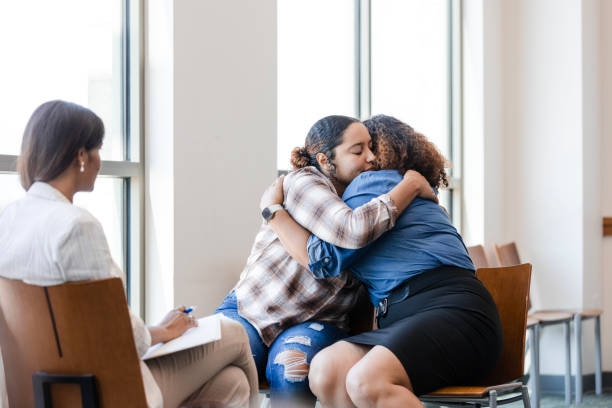 istock Unrecognizable therapist sits quietly while the mother and daughter enjoy a sentimental moment together 1820929461