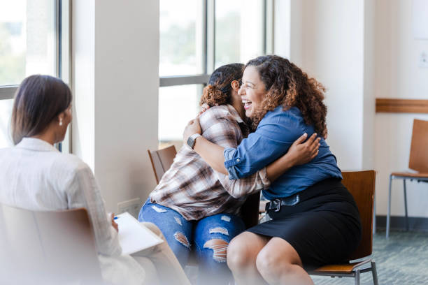 istock Mother and daughter embrace on another at therapy 1820929462