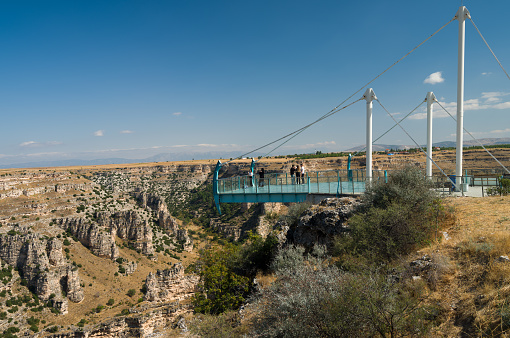 Usak, Turkey - October 3th, 2023 - Ulubey Canyon glass terrace. Famous place in Turkey travel. Tourists watch the canyon.