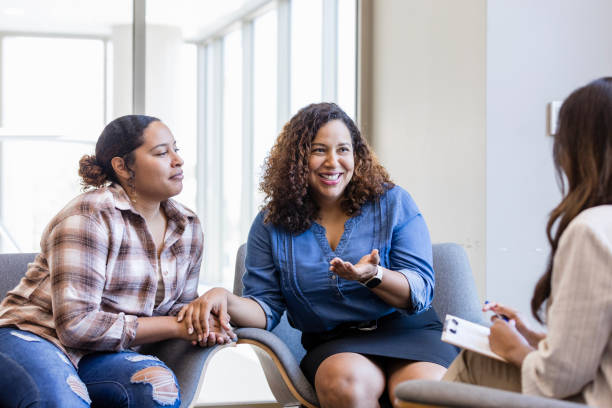 istock Daughter listens while mom talks to unrecognizable female counselor 1820933812