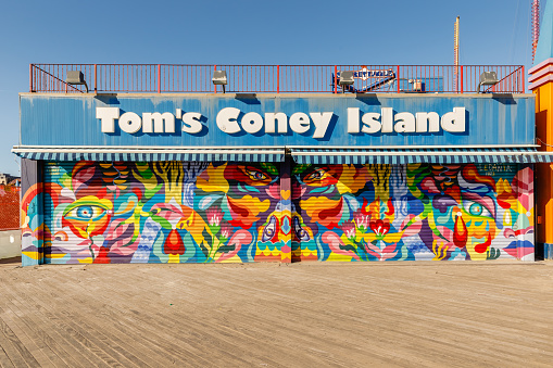 Brooklyn, New York City, USA - February 18, 2023: Facade of the closed Tom's Coney Island beachfront restaurant in Coney Island closed on a winter day