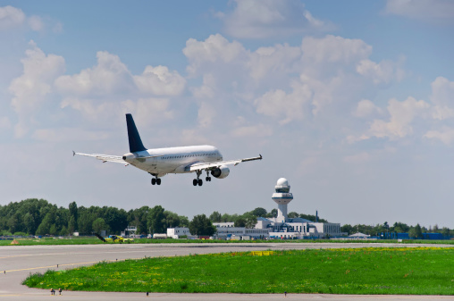 Airport Zurich ZRH with Airfield between the Gates.  Zurich Airport offers scheduled and charter flights to 203 destinations in 67countries. The Image was captured during spring season and shows several aircrafts at the gate.