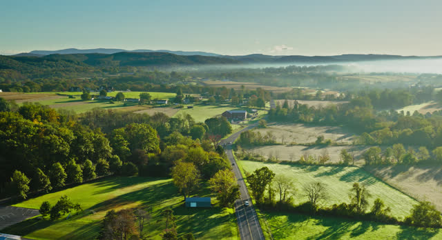 Drone Flight Over Country Road Towards Pennsdale, PA on a Misty Fall Morning