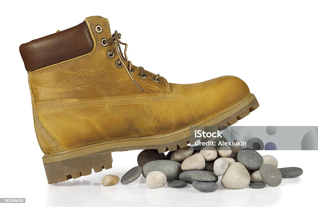 yellow boots nas pedras - Foto de stock de Antigo royalty-free