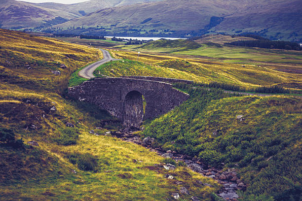 istock Old stone bridge in rural mountain landscape 182098763