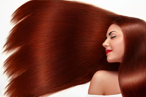 Beauty woman with luxurious long hair. Beauty Model Girl with Healthy red Hair. Beautiful Hair.