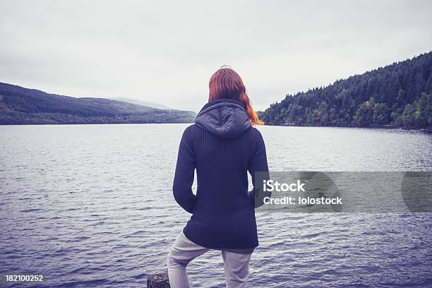 Woman Admiring Stillness Of The Lake Stock Photo - Download Image Now - Admiration, Adult, Adults Only