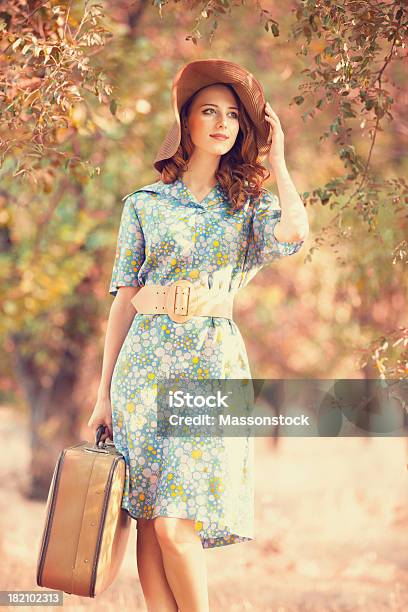 Redhead Girl With Suitcase At Autumn Alley Stock Photo - Download Image Now - Adult, Alley, Autumn