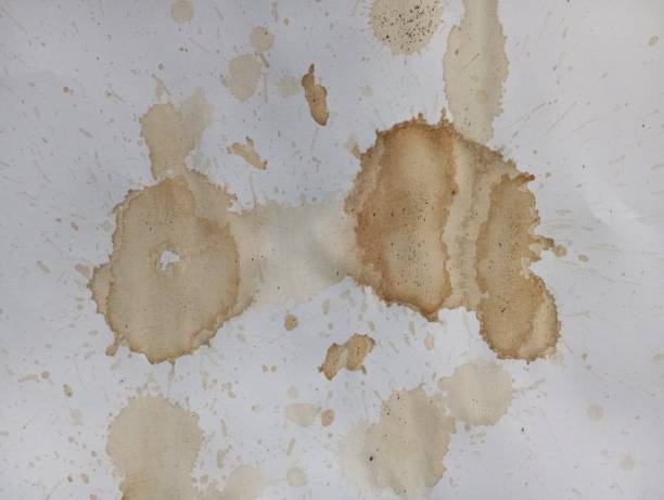 istock Abstract coffee grunge background. Brown coffee stains on white paper with copy space. Dirty paper with coffee drops. Coffee splash texture. Modern brown illustration. 1821024152