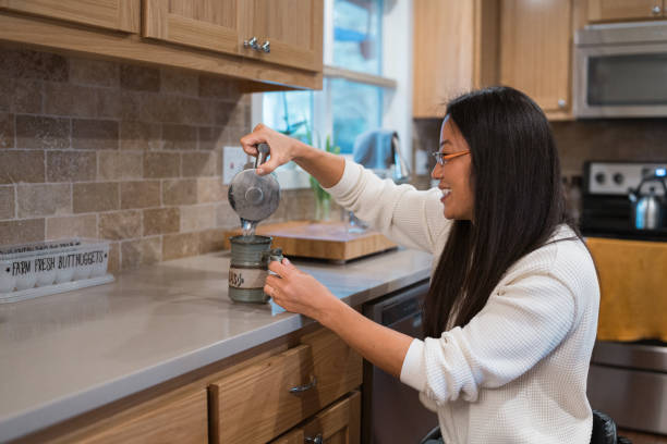 Woman with a physical disability making tea at home
