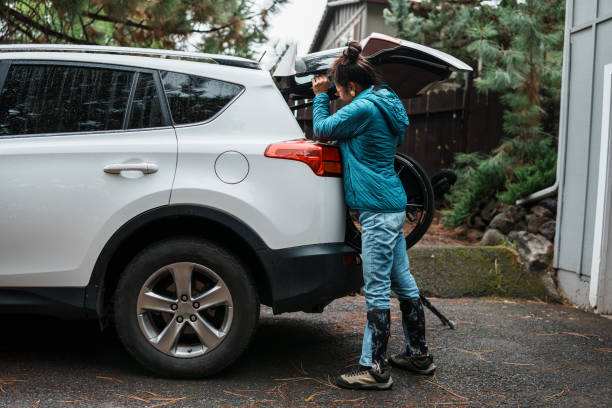 istock Woman with a physical disability loading her wheelchair into her car 1821029471