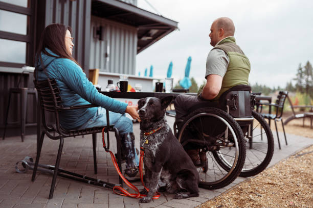 istock Friends with a range of disabilities enjoy lunch together 1821029957