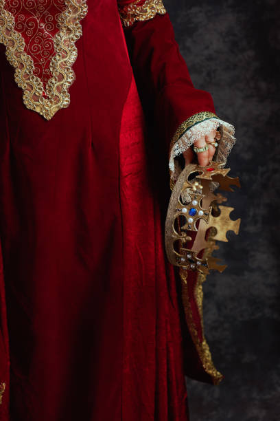 istock Closeup on medieval queen in red dress with crown 1821030215