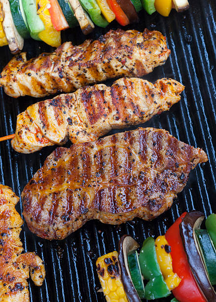 istock Delicious BBQ meat and vegetables on a barbecue 182105366