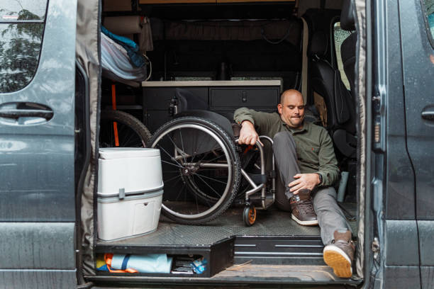 istock Man who uses wheelchair getting into his van 1821055757
