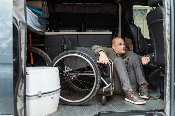 istock Man who uses wheelchair getting into his van 1821055759