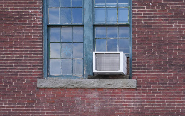 istock old air conditioner installed on rustic house window 1821082969
