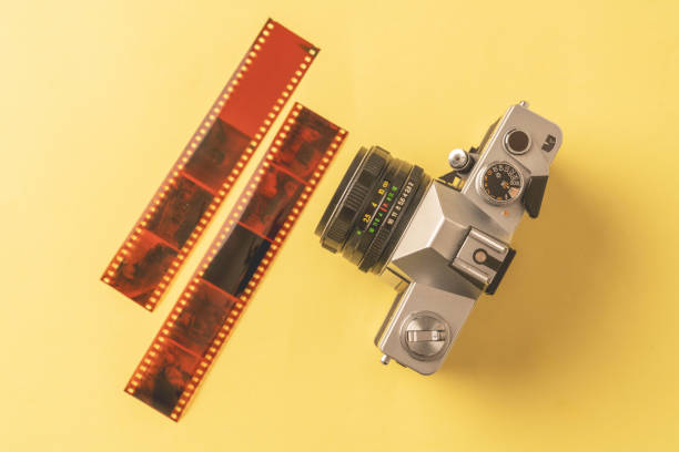 36 new film, treated film, analog camera There are 36 exposure and developed films on the table. film negative roll stock pictures, royalty-free photos & images