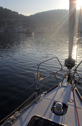Anchored sailboat at sunrise, Vis island, Adriatic Sea, Croatia